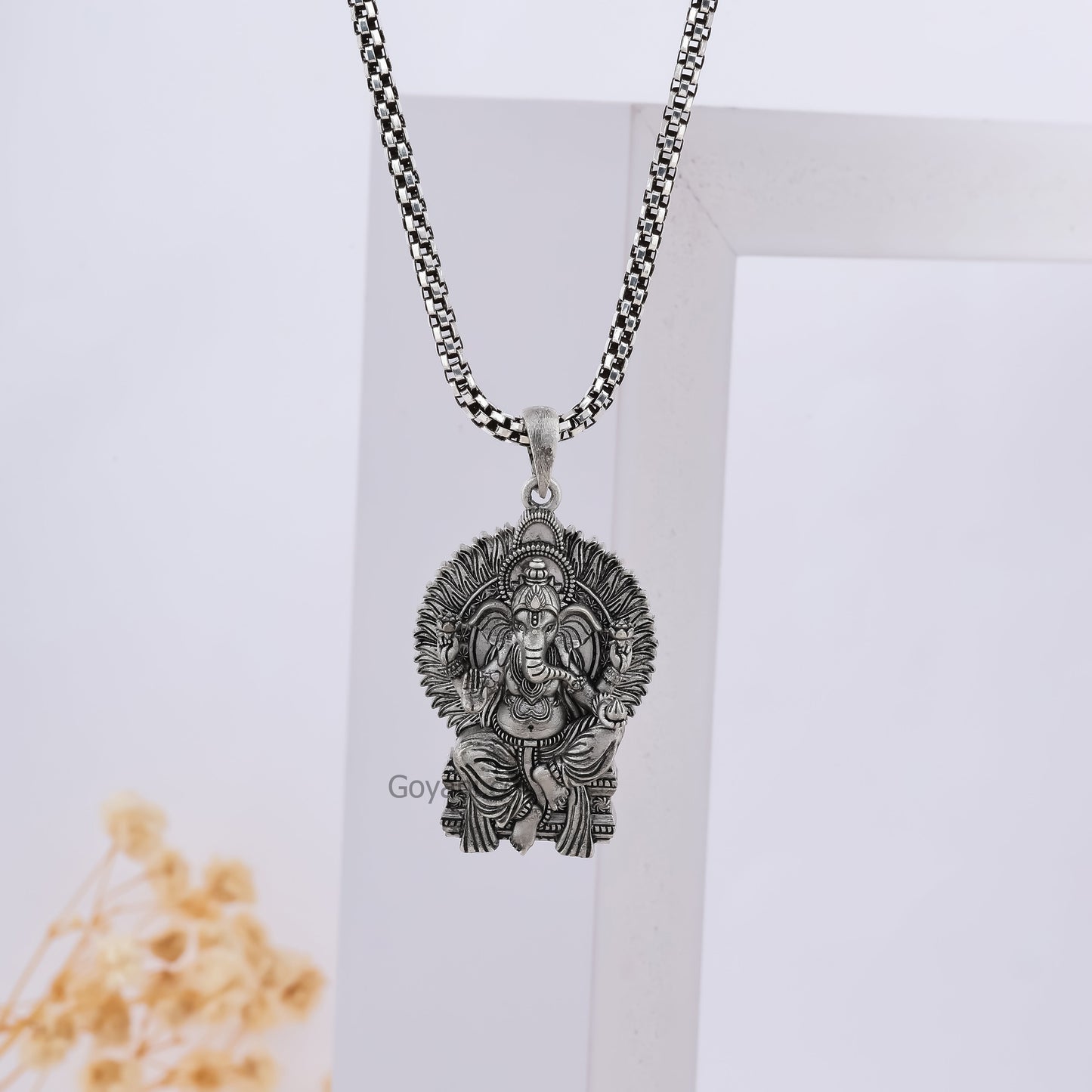 Royal Seat Ganeshji silver pendant close-up,